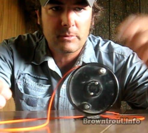 How do you set up a fishing reel?