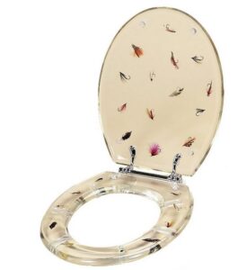 A toilet seat with hand tied flies in it.
