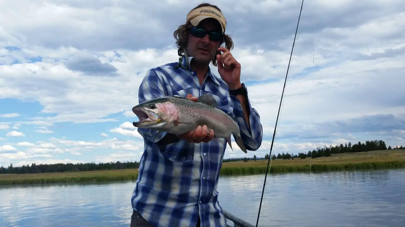 Dub paetz holding a rainbow trout