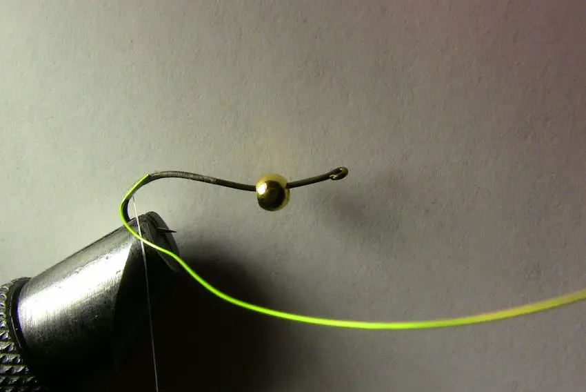 Attaching the green wire to use as ribbing on your fly