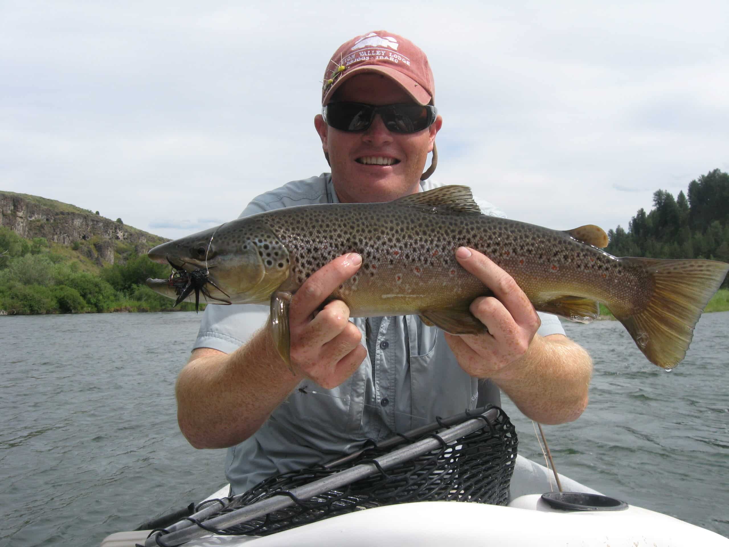 Dallin Owens hold a nice brown caught in the South Fork of the Snake River