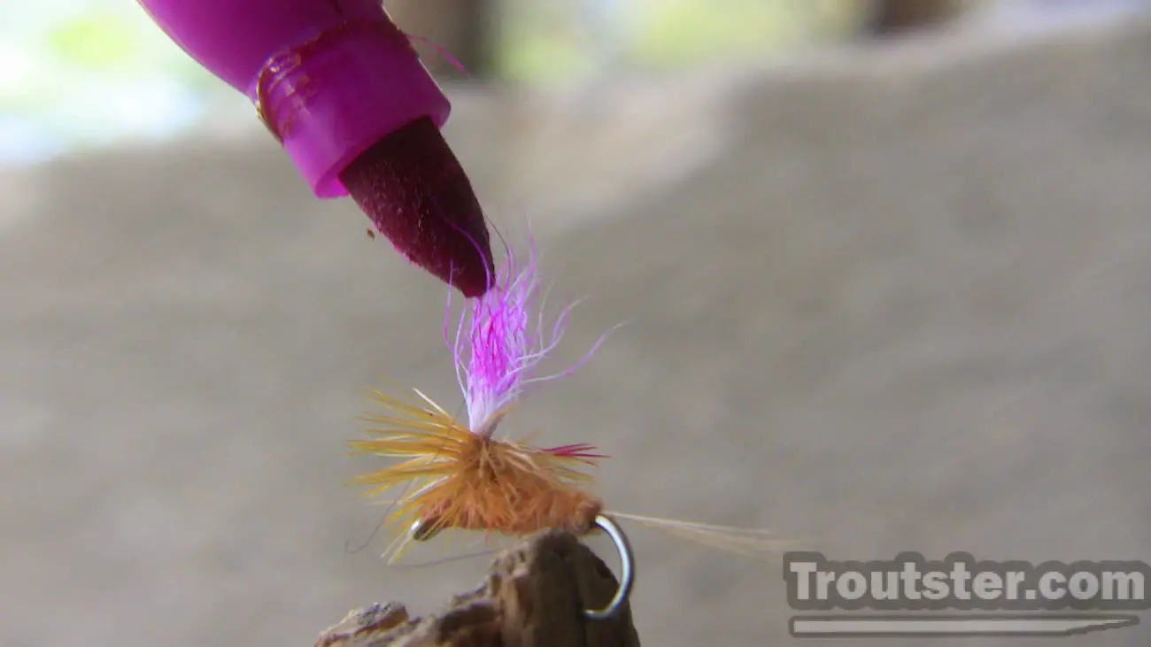 Coloring the parachute of a small dry fly can make it much more visible from a distance.
