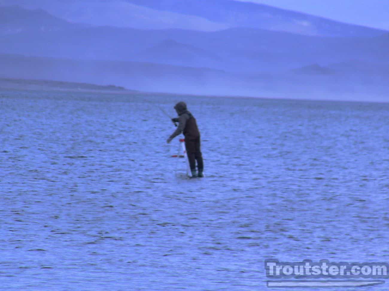 A fly fisherman casting on pyramid lake in Nevada