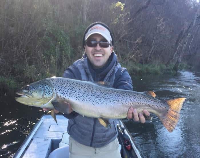 Jake jones with a 30 inch white river brown trout