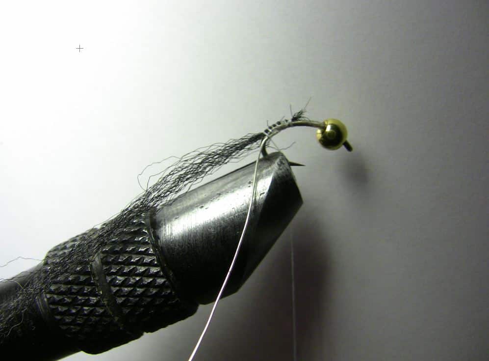 The first step to tying the zebra midge fly - tying in the wire and black floss