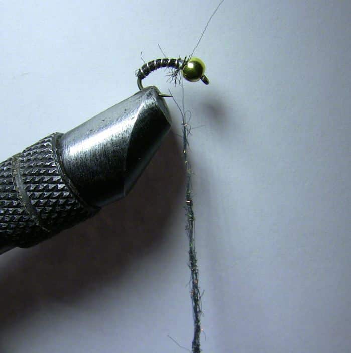 Wrap the wire around the zebra midge body and trim off the excess.